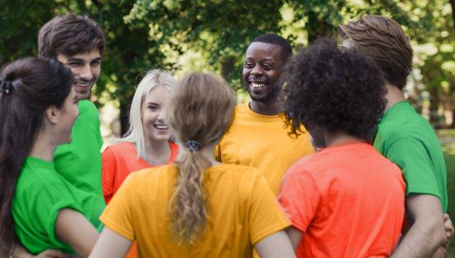 Meeting of young volunteers team in park