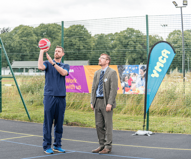 Young people master dunking skills at multi-use games area launch