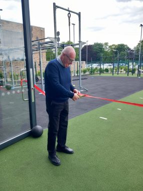 Michael McKeever Chair of the Board of YMCA Newark & Sherwood cuts the ribbon to officially inaugurate the outdoor fitness space.