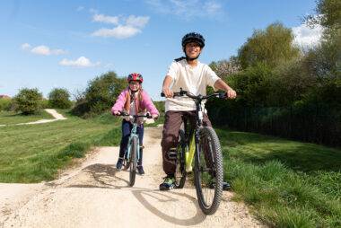 YMCA Y-kids - Two children ready to cycle to YMCA community trail