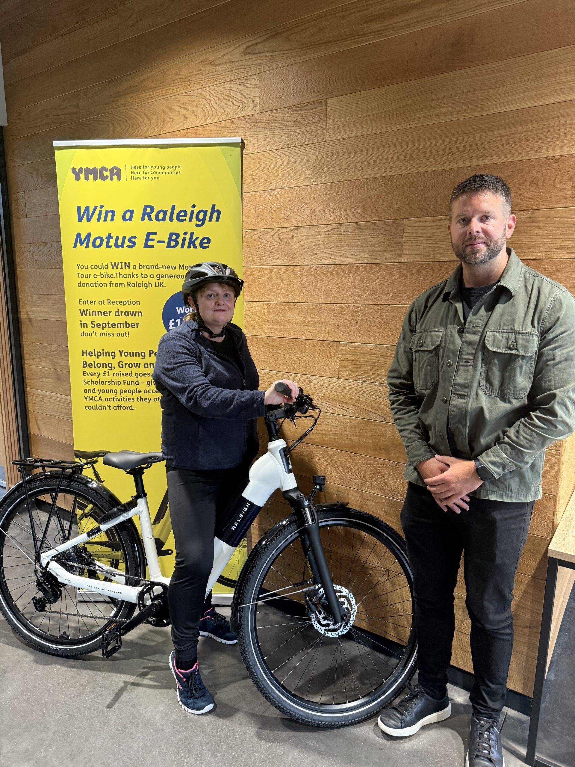 Raleigh raffle prize winner Helen Knight with Chris Harby